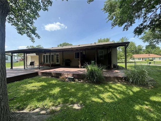 241 E S St, Peculiar, MO 64078 - back of house featuring a wooden deck