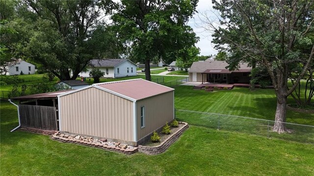 241 E S St, Peculiar, MO 64078 - view of pole building with a fenced backyard