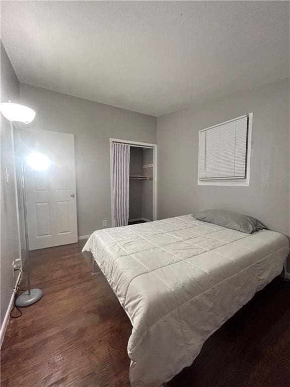 409 N Geronimo Dr, Independence, MO 64056 - bedroom featuring dark wood-type flooring and a closet