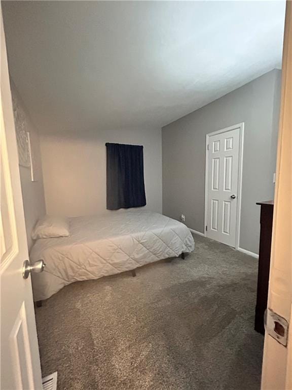 409 N Geronimo Dr, Independence, MO 64056 - bedroom with carpet and baseboards