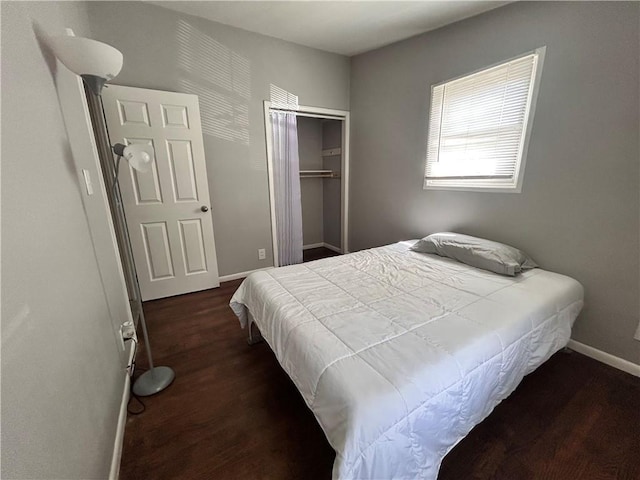 409 N Geronimo Dr, Independence, MO 64056 - bedroom featuring dark wood finished floors and a closet