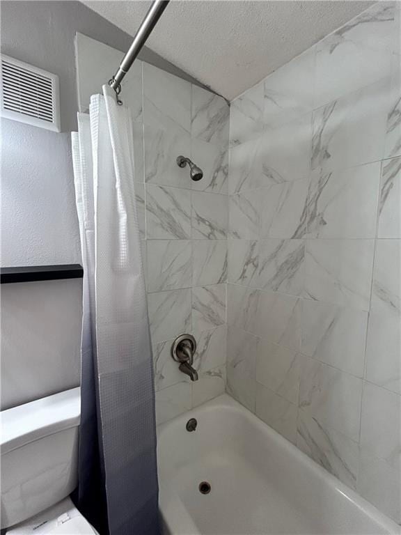 409 N Geronimo Dr, Independence, MO 64056 - bathroom with a textured ceiling and shower / bath combo with shower curtain