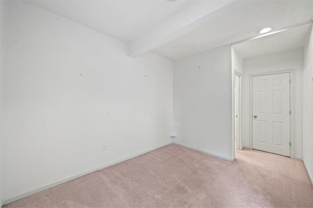 7633 W 148th Ter, Overland Park, KS 66223 - spare room with light colored carpet and beamed ceiling