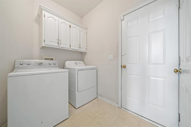 7633 W 148th Ter, Overland Park, KS 66223 - laundry room with washing machine and dryer, cabinet space, and light floors