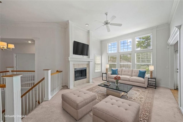 7633 W 148th Ter, Overland Park, KS 66223 - living area with crown molding, carpet, a ceiling fan, a chandelier, and a tiled fireplace