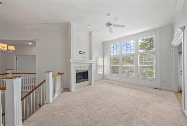 7633 W 148th Ter, Overland Park, KS 66223 - unfurnished living room featuring a chandelier, ornamental molding, carpet flooring, a ceiling fan, and a fireplace