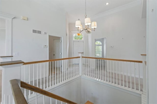 7633 W 148th Ter, Overland Park, KS 66223 - corridor with an upstairs landing, a chandelier, ornamental molding, and recessed lighting
