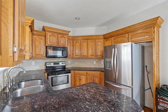7633 W 148th Ter, Overland Park, KS 66223 - kitchen with appliances with stainless steel finishes, tasteful backsplash, and dark stone counters