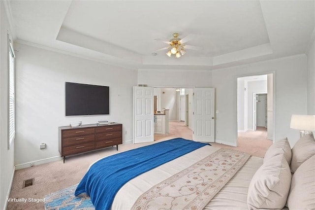7633 W 148th Ter, Overland Park, KS 66223 - bedroom featuring a raised ceiling, light carpet, and ceiling fan