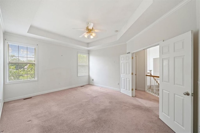 7633 W 148th Ter, Overland Park, KS 66223 - unfurnished room with a tray ceiling, ceiling fan, light colored carpet, and crown molding