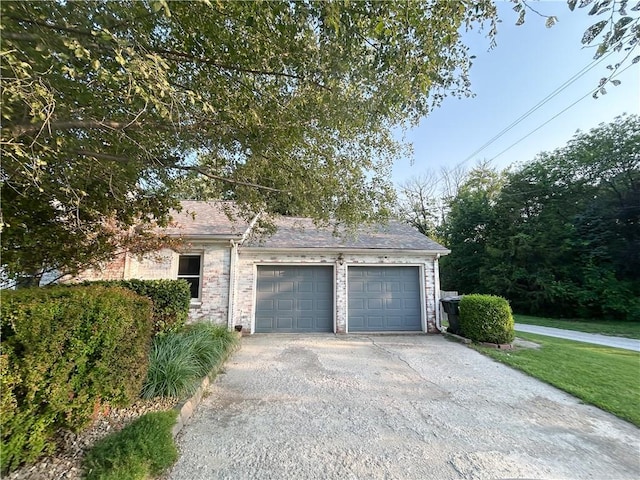 8719 E 57th St, Raytown, MO 64129 - garage featuring driveway