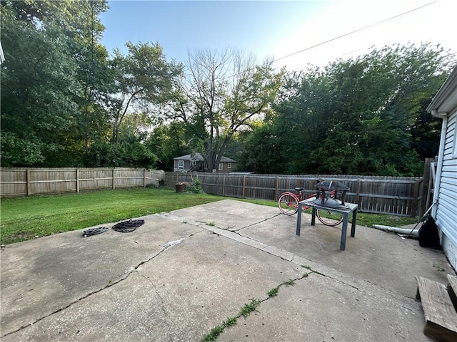 8719 E 57th St, Raytown, MO 64129 - fenced backyard with a patio