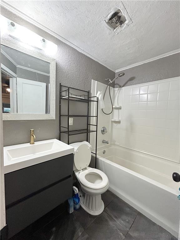 8719 E 57th St, Raytown, MO 64129 - full bathroom with a textured wall, a textured ceiling, shower / washtub combination, vanity, and tile patterned flooring