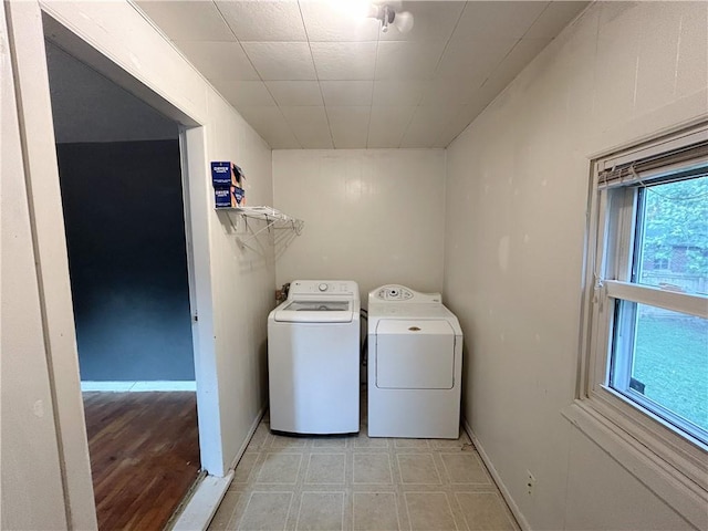 8719 E 57th St, Raytown, MO 64129 - laundry room featuring washing machine and clothes dryer and baseboards