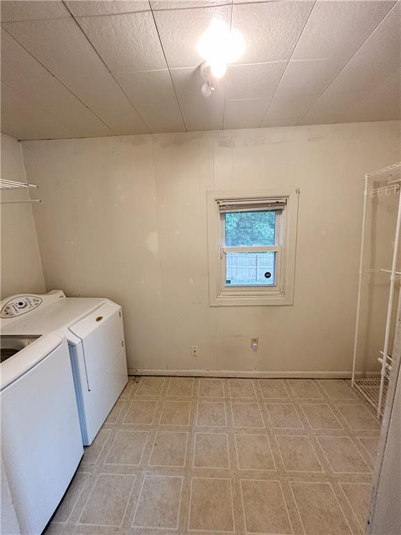 8719 E 57th St, Raytown, MO 64129 - laundry room featuring light floors and separate washer and dryer