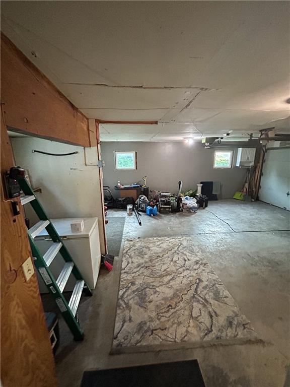 8719 E 57th St, Raytown, MO 64129 - basement with plenty of natural light and a garage