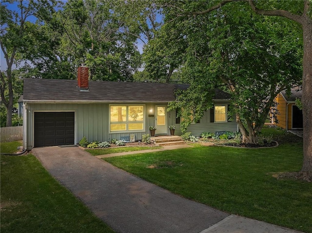 7135 Conser St, Overland Park, KS 66204 - single story home featuring a chimney, an attached garage, board and batten siding, and driveway