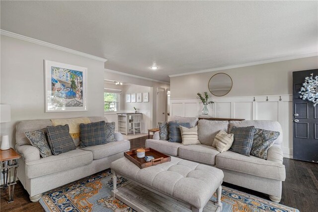 7135 Conser St, Overland Park, KS 66204 - living room with dark wood-style flooring, crown molding, and a wainscoted wall