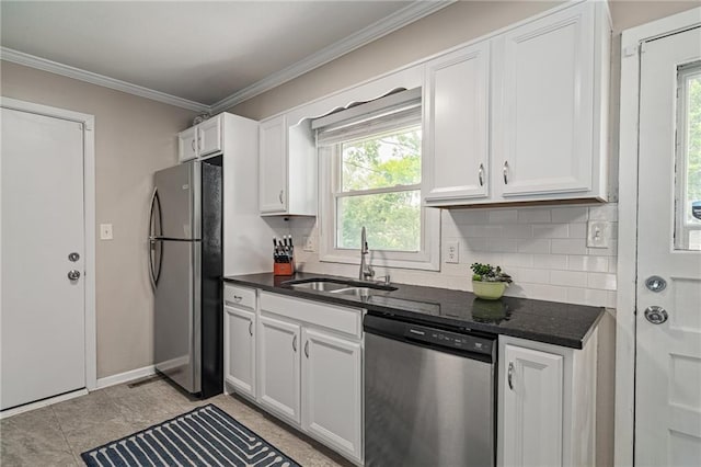 7135 Conser St, Overland Park, KS 66204 - kitchen with stainless steel appliances, backsplash, white cabinets, and crown molding