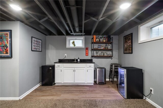 7135 Conser St, Overland Park, KS 66204 - indoor wet bar with healthy amount of natural light and light wood-type flooring