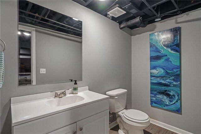 7135 Conser St, Overland Park, KS 66204 - half bath featuring vanity and wood finished floors
