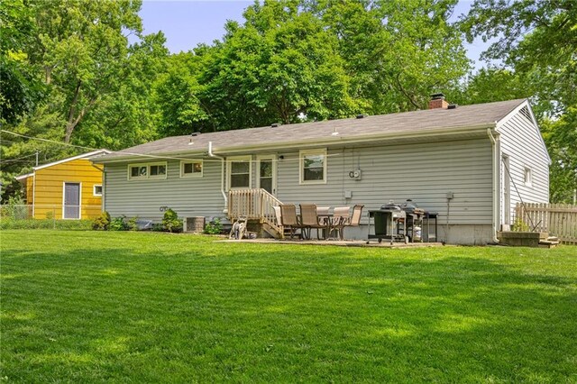 7135 Conser St, Overland Park, KS 66204 - back of property with a chimney and a patio area