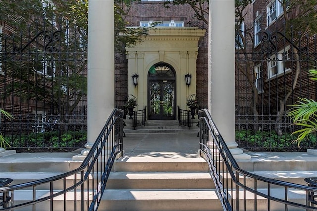4618 Warwick Blvd Unit 7F, Kansas City, MO 64112 - doorway to property with french doors and brick siding