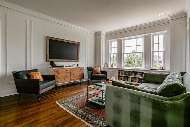 4618 Warwick Blvd Unit 7F, Kansas City, MO 64112 - living area featuring crown molding, a decorative wall, dark wood finished floors, and healthy amount of natural light