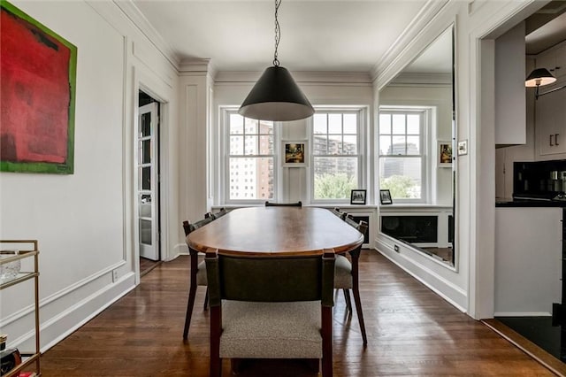 4618 Warwick Blvd Unit 7F, Kansas City, MO 64112 - dining room with ornamental molding and dark wood finished floors