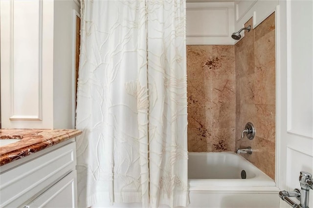 4618 Warwick Blvd Unit 7F, Kansas City, MO 64112 - bathroom featuring shower / bath combo with shower curtain and vanity