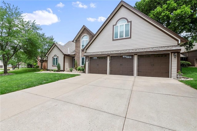 3917 SW Windjammer Ct, Lees Summit, MO 64082 - traditional-style home with a front yard, concrete driveway, an attached garage, and roof with shingles