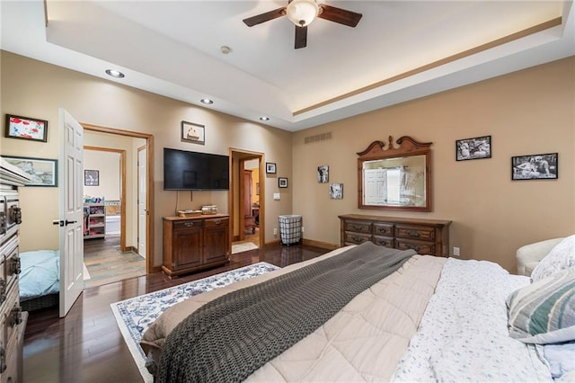 3917 SW Windjammer Ct, Lees Summit, MO 64082 - bedroom with wood finished floors, recessed lighting, a raised ceiling, baseboards, and ceiling fan