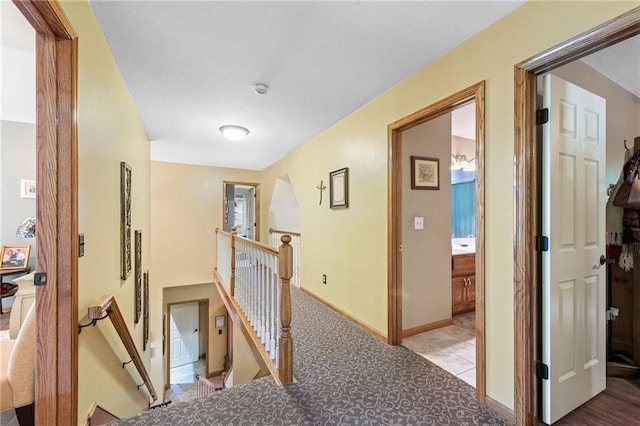 3917 SW Windjammer Ct, Lees Summit, MO 64082 - corridor with an upstairs landing, carpet, and baseboards