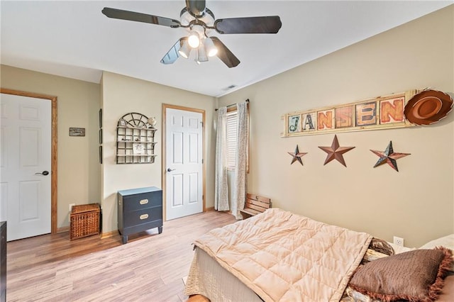 3917 SW Windjammer Ct, Lees Summit, MO 64082 - bedroom with light wood finished floors and ceiling fan