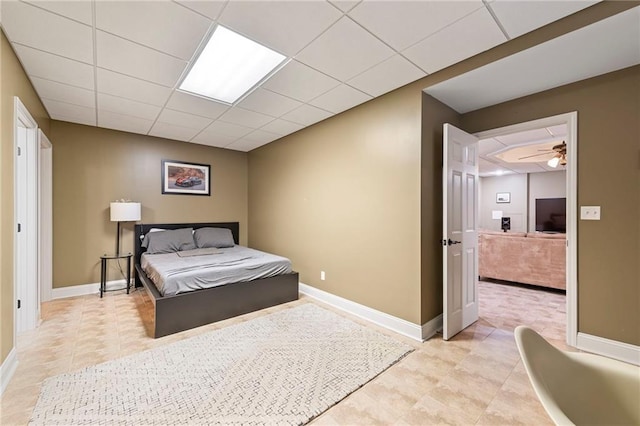 3917 SW Windjammer Ct, Lees Summit, MO 64082 - bedroom with baseboards, light tile patterned floors, and a paneled ceiling