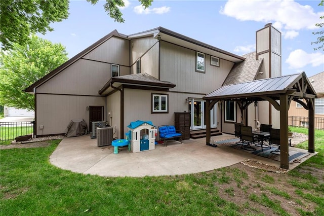 3917 SW Windjammer Ct, Lees Summit, MO 64082 - rear view of house featuring a gazebo, a patio, a chimney, roof with shingles, and central AC
