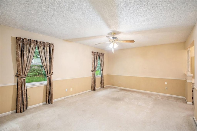 2409 NE 73rd Ter, Gladstone, MO 64118 - unfurnished room with ceiling fan, carpet flooring, a textured ceiling, and baseboards
