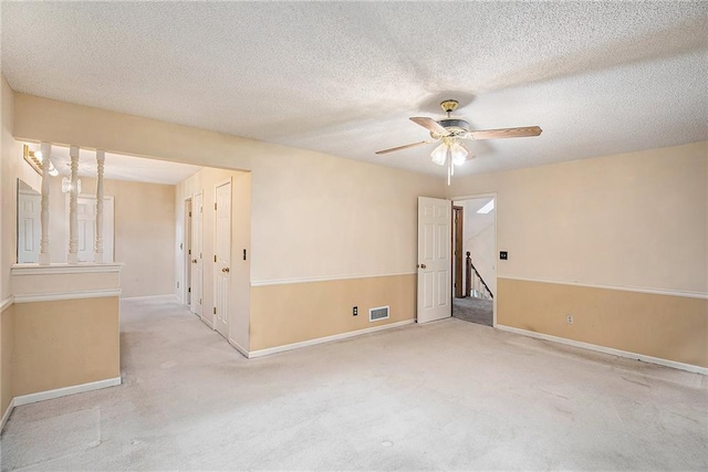 2409 NE 73rd Ter, Gladstone, MO 64118 - unfurnished room featuring a ceiling fan, carpet flooring, baseboards, and a textured ceiling
