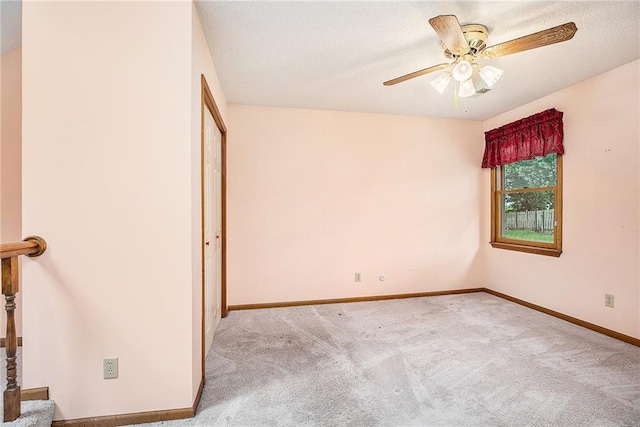 2409 NE 73rd Ter, Gladstone, MO 64118 - unfurnished bedroom with carpet floors, baseboards, and a ceiling fan