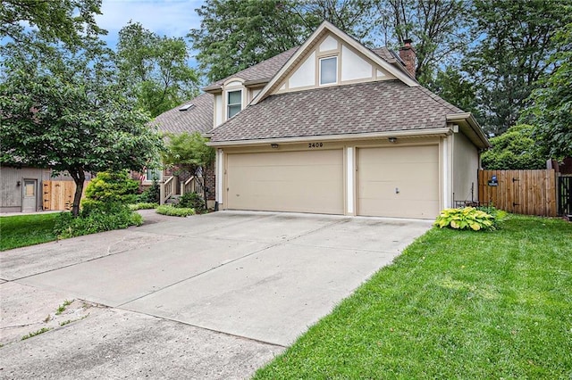 2409 NE 73rd Ter, Gladstone, MO 64118 - view of front of property featuring a chimney, a garage, driveway, and stucco siding