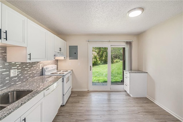 2701 NW 5th St, Blue Springs, MO 64014 - kitchen with electric panel, white appliances, range hood, decorative backsplash, and light wood-style flooring