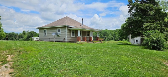 123 NW 1501st Rd, Holden, MO 64040 - view of side of home with covered porch, a yard, and an outdoor structure