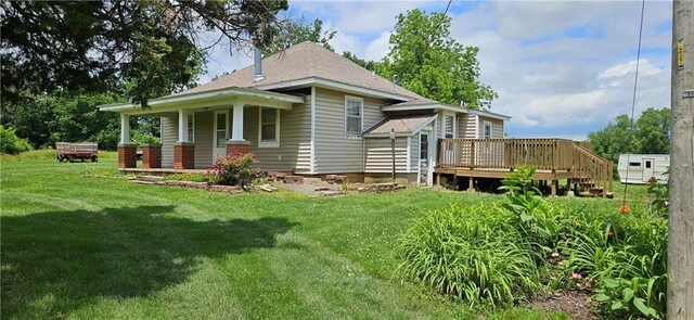 123 NW 1501st Rd, Holden, MO 64040 - rear view of property featuring a yard and a deck