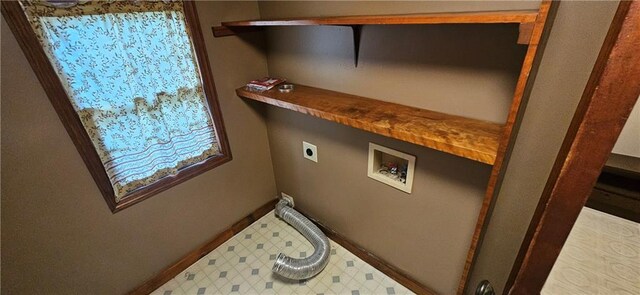 123 NW 1501st Rd, Holden, MO 64040 - washroom featuring hookup for an electric dryer, hookup for a washing machine, baseboards, and tile patterned floors