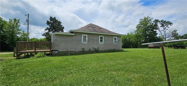 123 NW 1501st Rd, Holden, MO 64040 - view of side of property featuring a wooden deck and a lawn