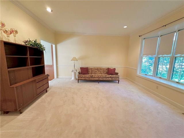 925 S Walnut St, Maryville, MO 64468 - living area featuring light colored carpet, ornamental molding, baseboards, and recessed lighting