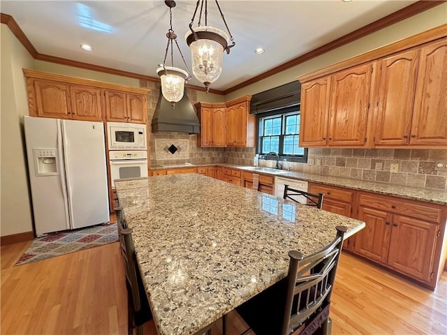 925 S Walnut St, Maryville, MO 64468 - kitchen featuring white appliances, custom range hood, ornamental molding, a sink, and light stone countertops