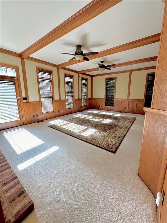 925 S Walnut St, Maryville, MO 64468 - unfurnished living room with a wainscoted wall, carpet, a ceiling fan, and ornamental molding