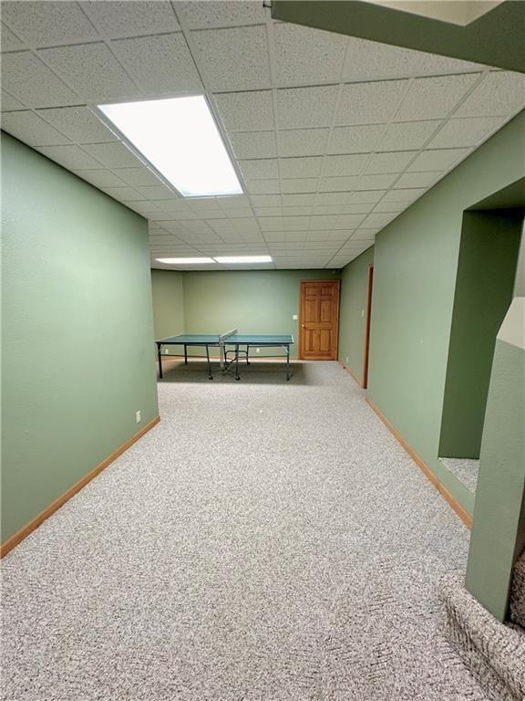 925 S Walnut St, Maryville, MO 64468 - finished basement featuring carpet, baseboards, and a drop ceiling