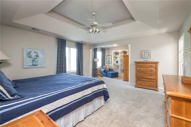 8355 Hallet St, Lenexa, KS 66215 - carpeted bedroom featuring a raised ceiling and a ceiling fan